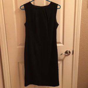 Sleeveless black sheath dress